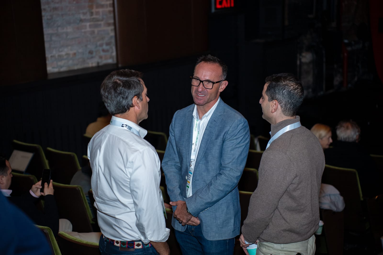 Attendees catching up in the Cherry Lane theatre